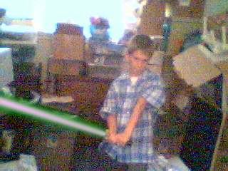 Friend of mine holding a lightsaber; Actual size=140 pixels wide